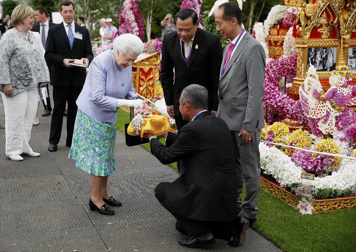 Queen Elizabeth II visits the Thai exhibit during a visit to the Chelsea Flower Show